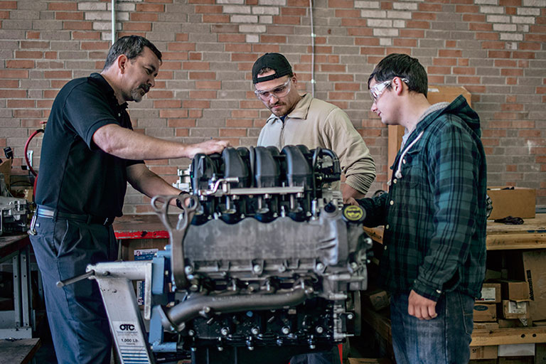 Students working on an truck engine