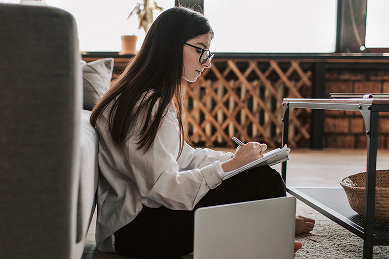 Girl Studying in Living Room